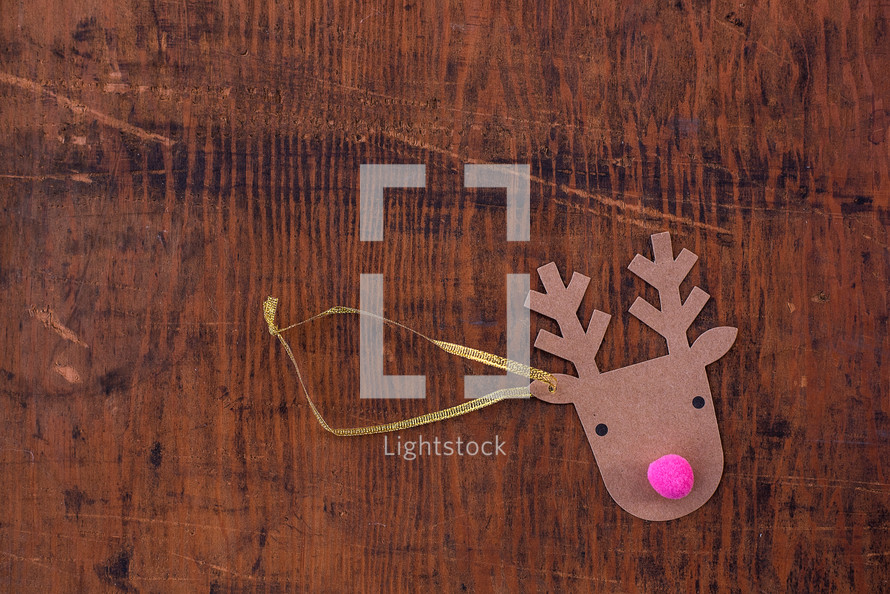 reindeer ornament on a wood background