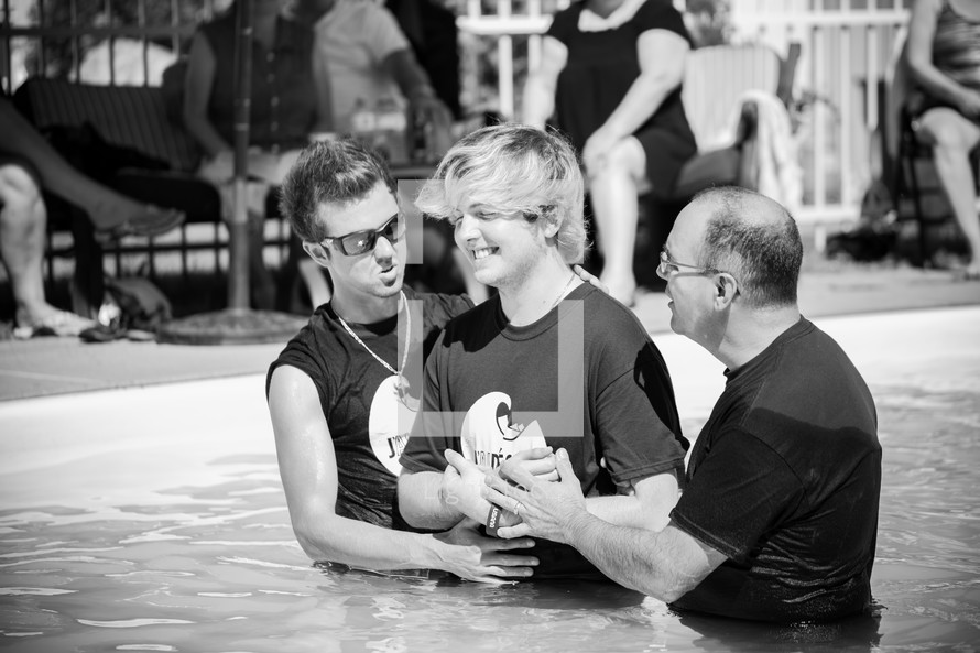 a teen boy being baptized 