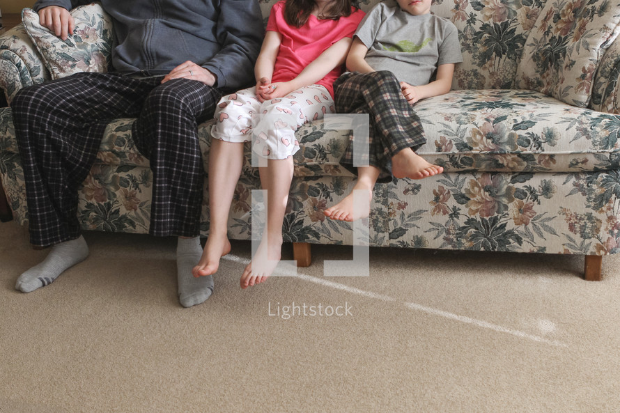 family sitting on a couch 