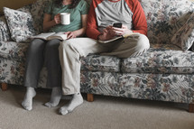 couple sitting on the couch watching church online