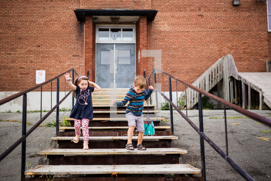 children in front of a school 
