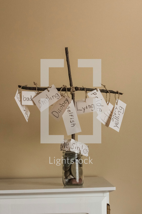 sins hanging from a cross 