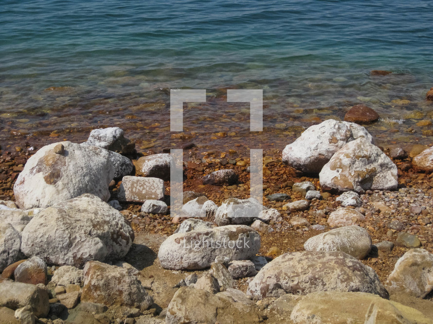 Salt covered rocks on the Dead Sea shore