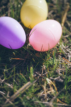 three Easter eggs in the grass