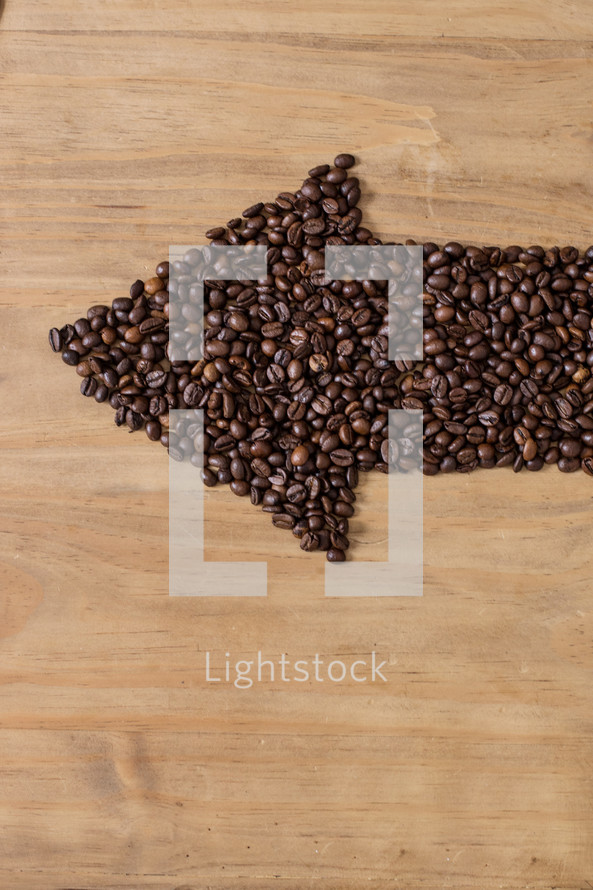 Coffee beans in an arrow formation.