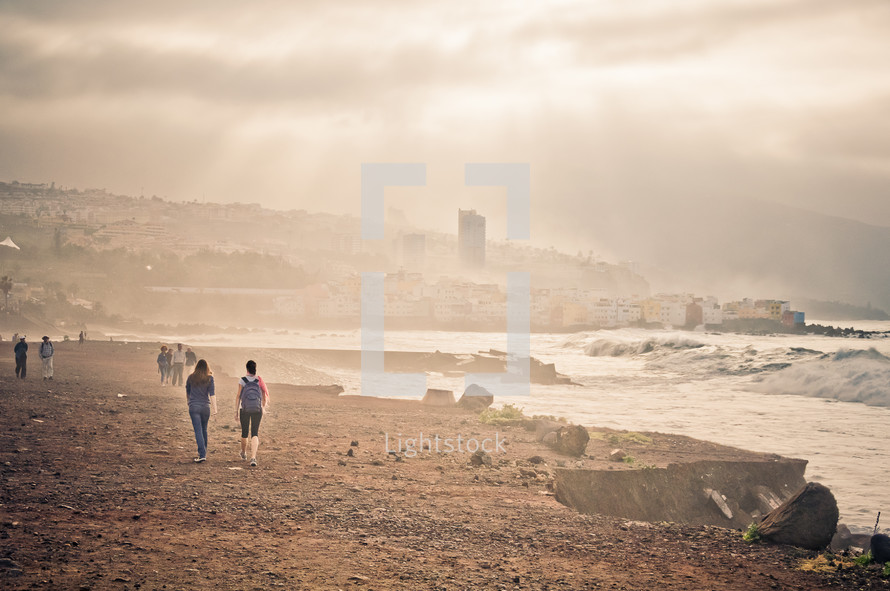 people walking on a shore in Tenerife, Spain