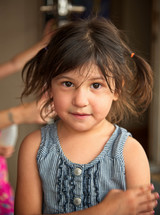 young girl with messy pigtails 