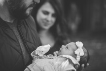 A man holding a newborn 