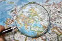 magnifying glass over the map of Ukraine 