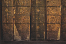 Old weathered books on a shelf