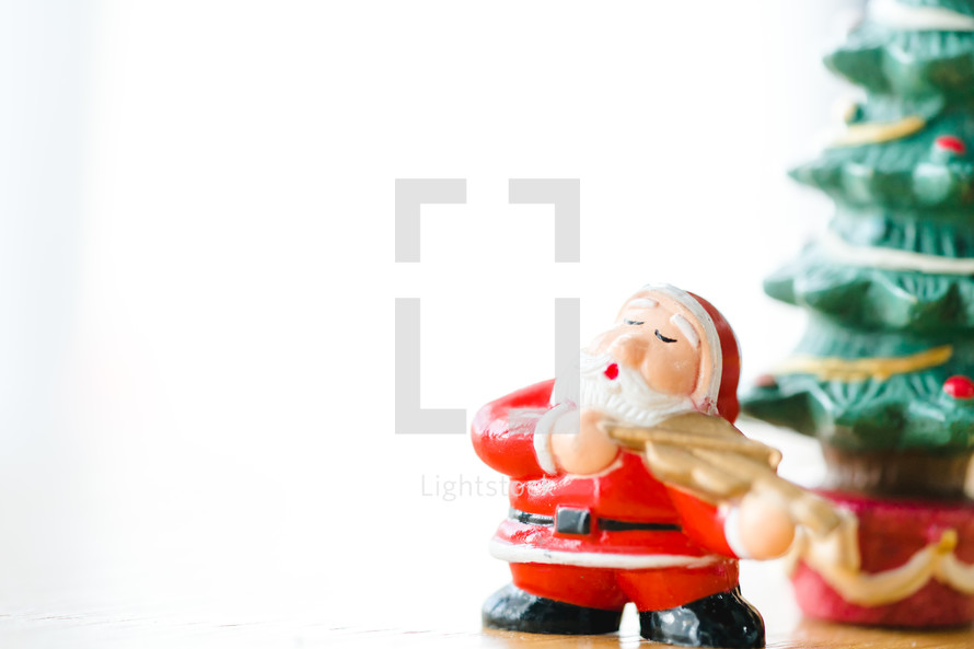 Santa Claus figurine against a white background 