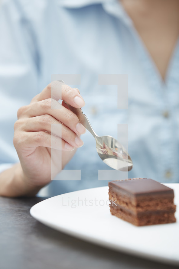 a woman eating cake 