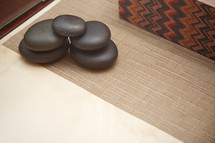 smooth stones on a desk 