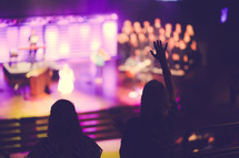 raised hands during a contemporary worship service 