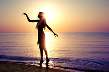 dancer on a beach at sunset 