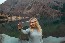 a woman taking a selfie 