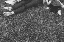 Mother, son, and daughter lying in grass