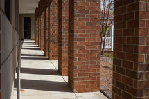 brick columns supporting a walkway 