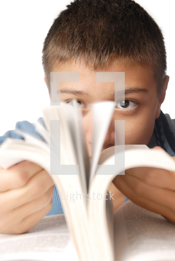 young boy with interesting book