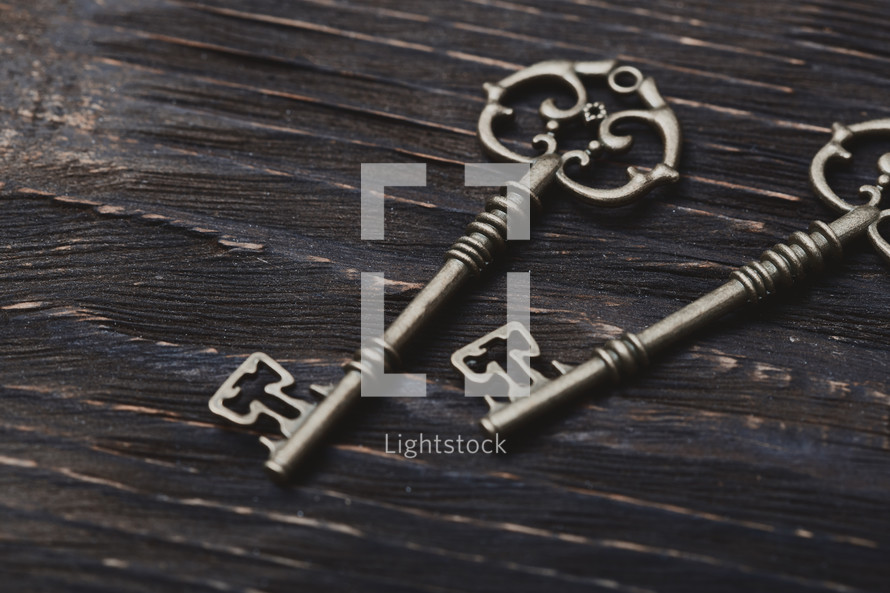 skeleton key on wood background 
