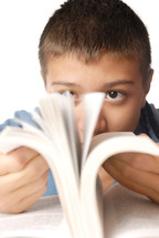 young boy with interesting book