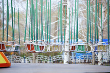 swinging chairs at an amusement park 