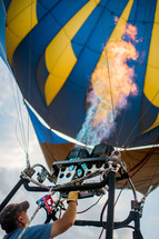 A man operating a hot air balloon.