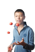 boy juggling balls 