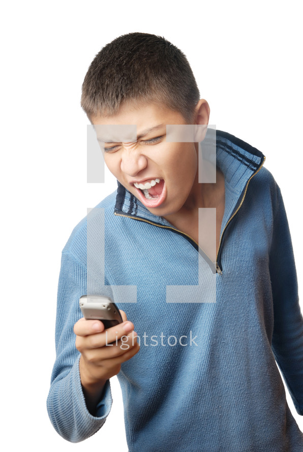 Boy with cell phone expressing negative feelings