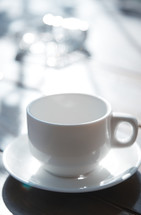 white coffee cup and saucer 