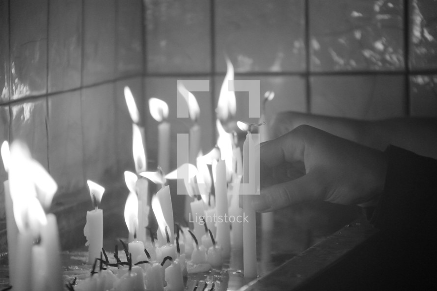 melting vigil candles and flames 