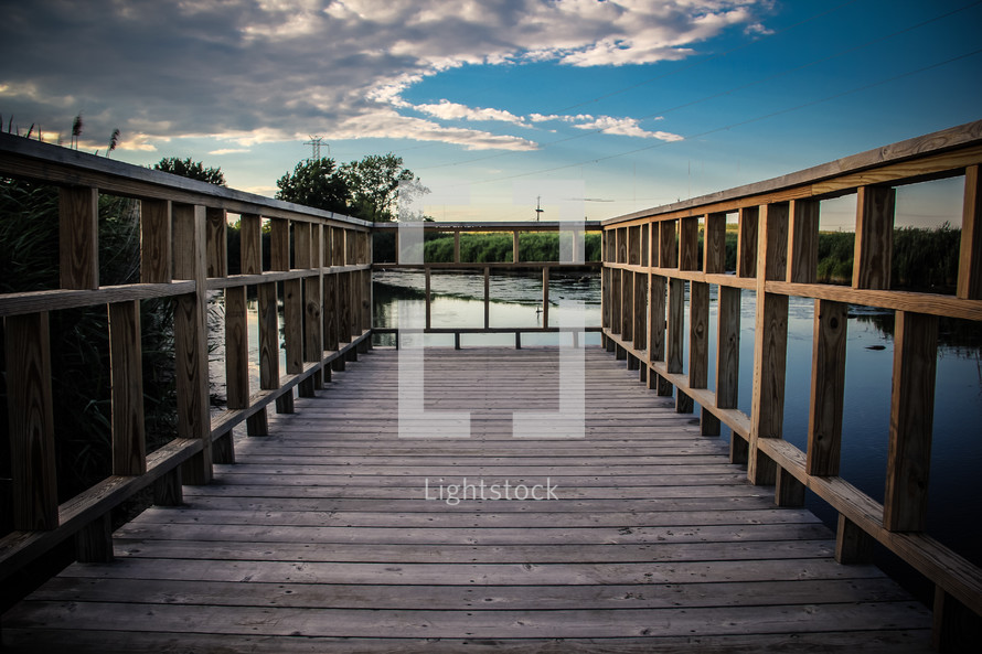 boardwalk dock over a lake 