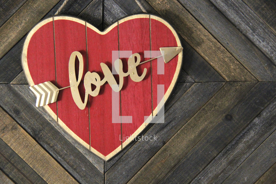 love heart sign on a wood background 