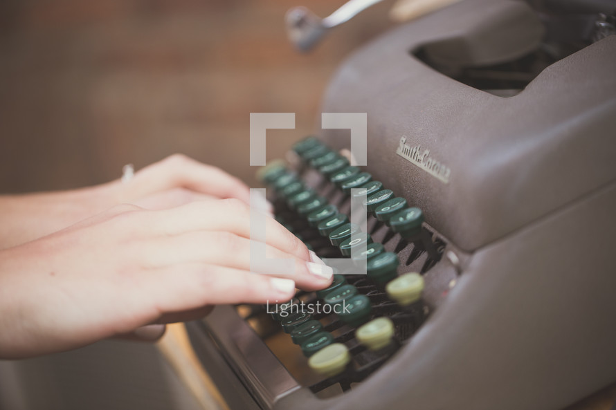 hands on a typewriter 