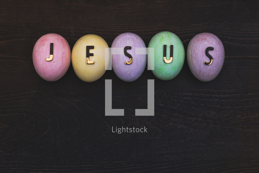 word Jesus on pastel Easter eggs 