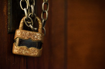 rusty padlock on a chain 