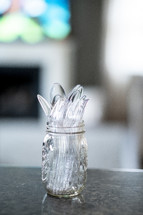 plastic silverware in a mason jar 
