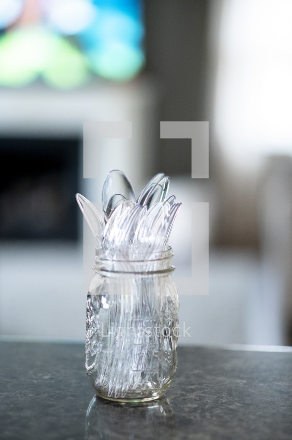plastic silverware in a mason jar 