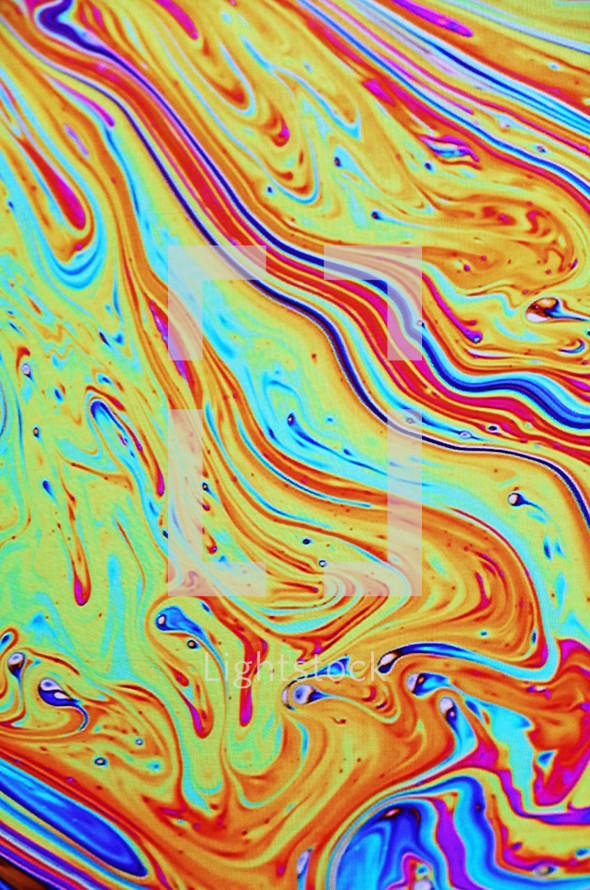 swirled rainbow paint abstract background 