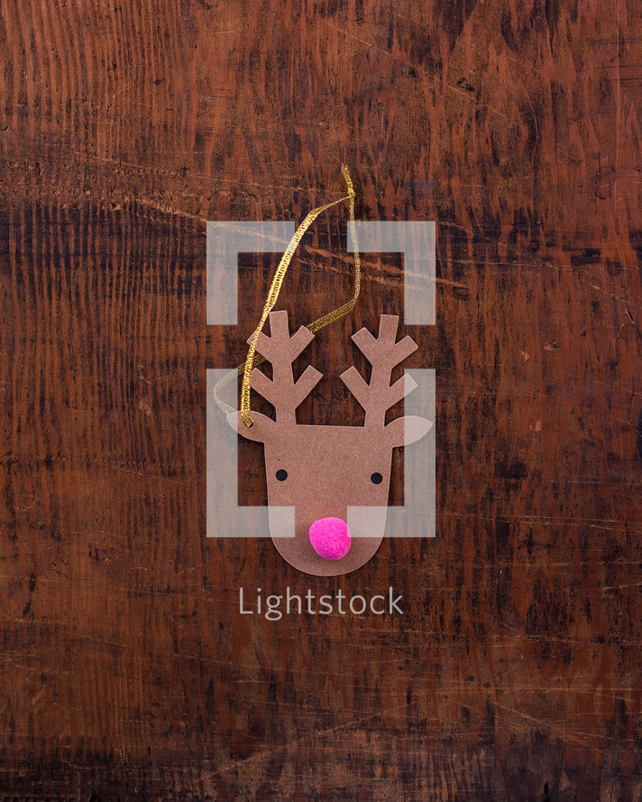 reindeer Christmas ornament on wood 