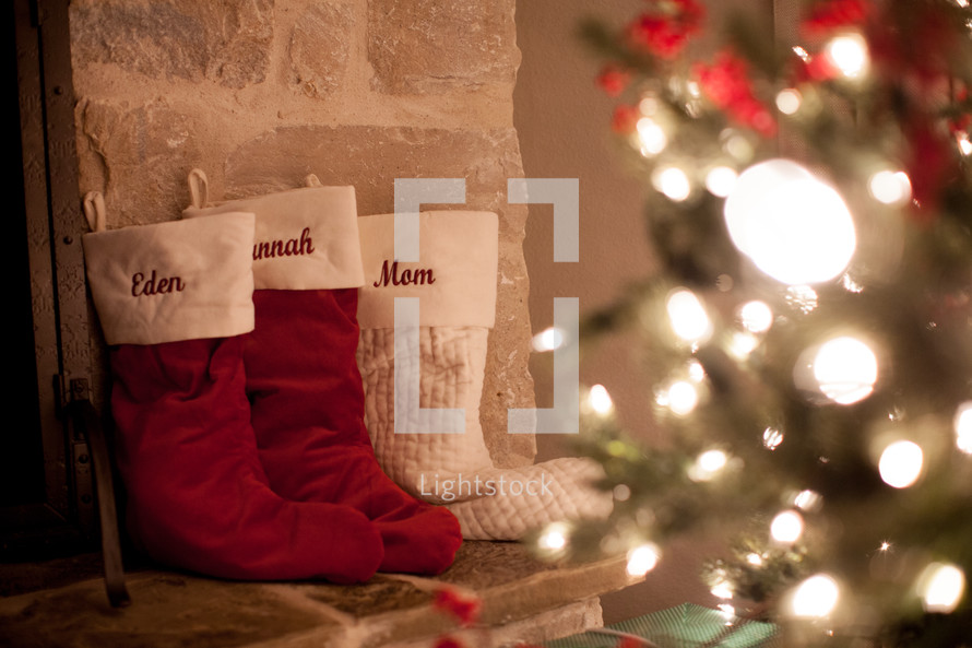 Christmas stockings by a fireplace 