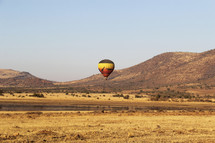 Hot air balloons over the African savanna 