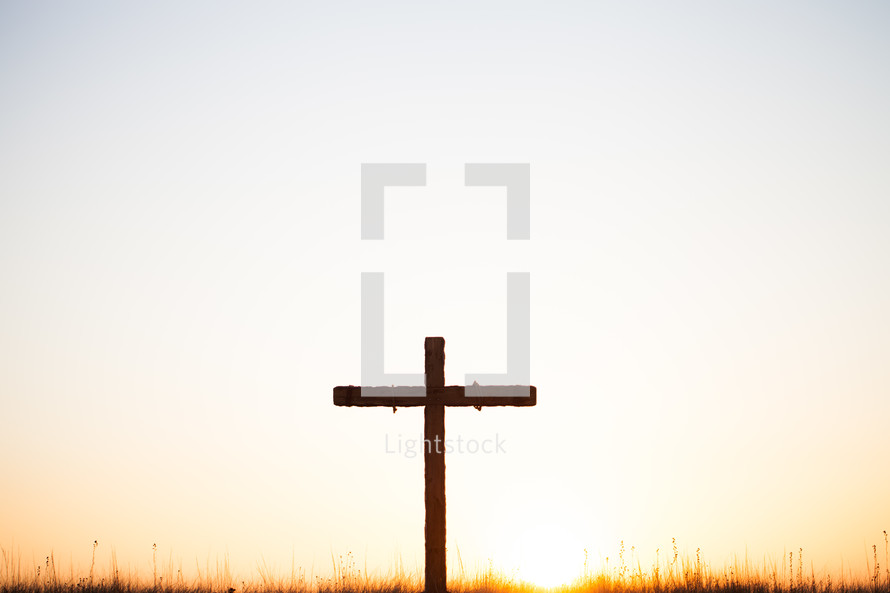 Cross on the hill at sunrise.