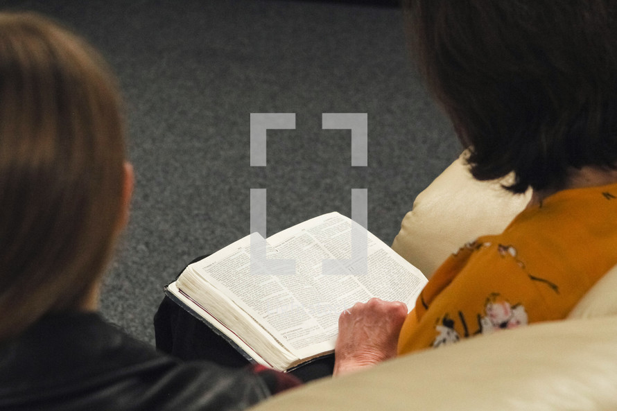 women reading a Bible in church 