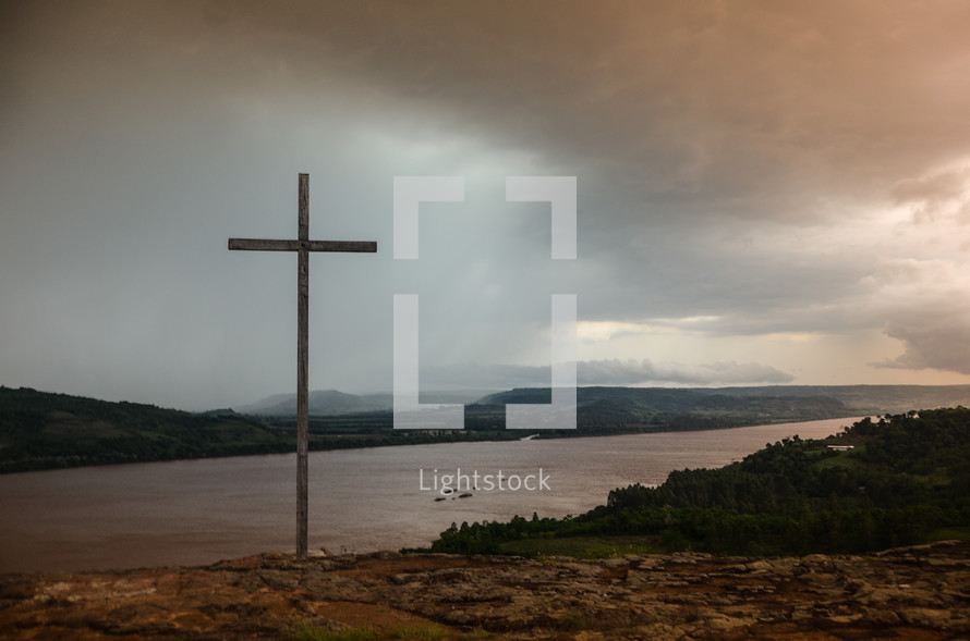 cross on a lake shore 