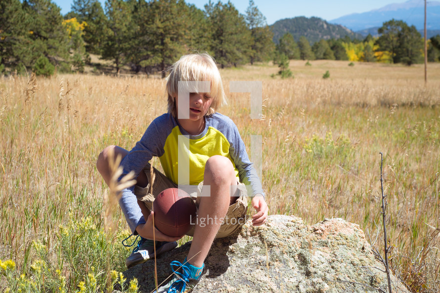 a boy child exploring nature 