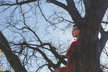 boy climbing a tree 