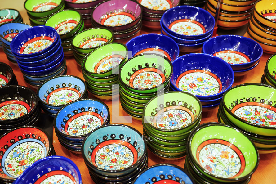 colorful stacked bowls at a market 