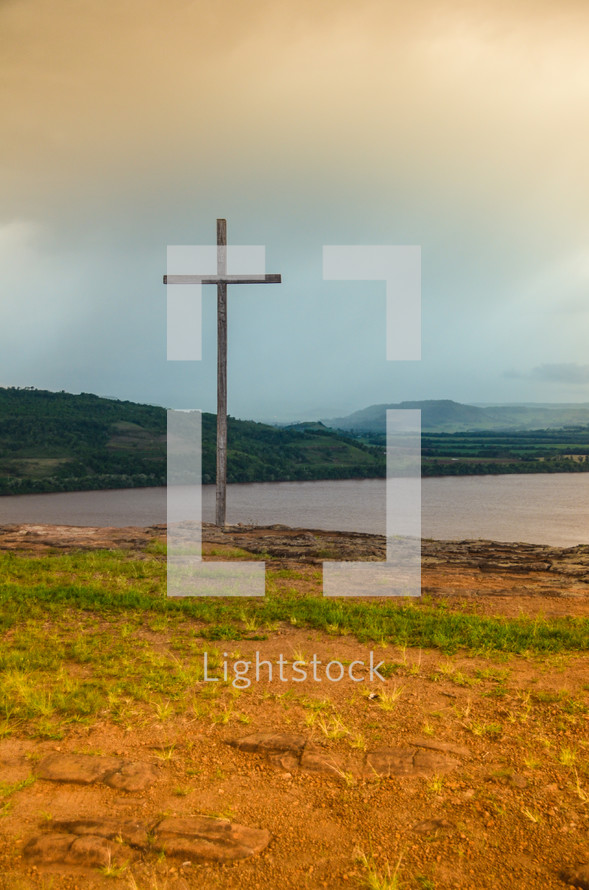 cross on a lake shore 