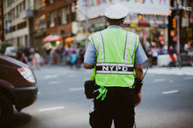 NYPD office directing traffic 